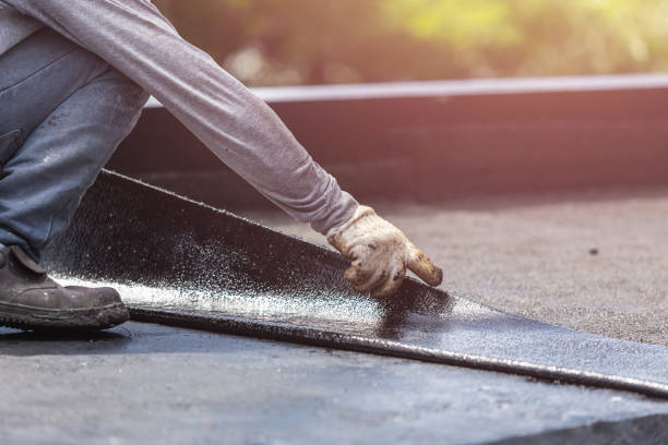 Professional Basement Waterproofing technician working in Columbia City, OR